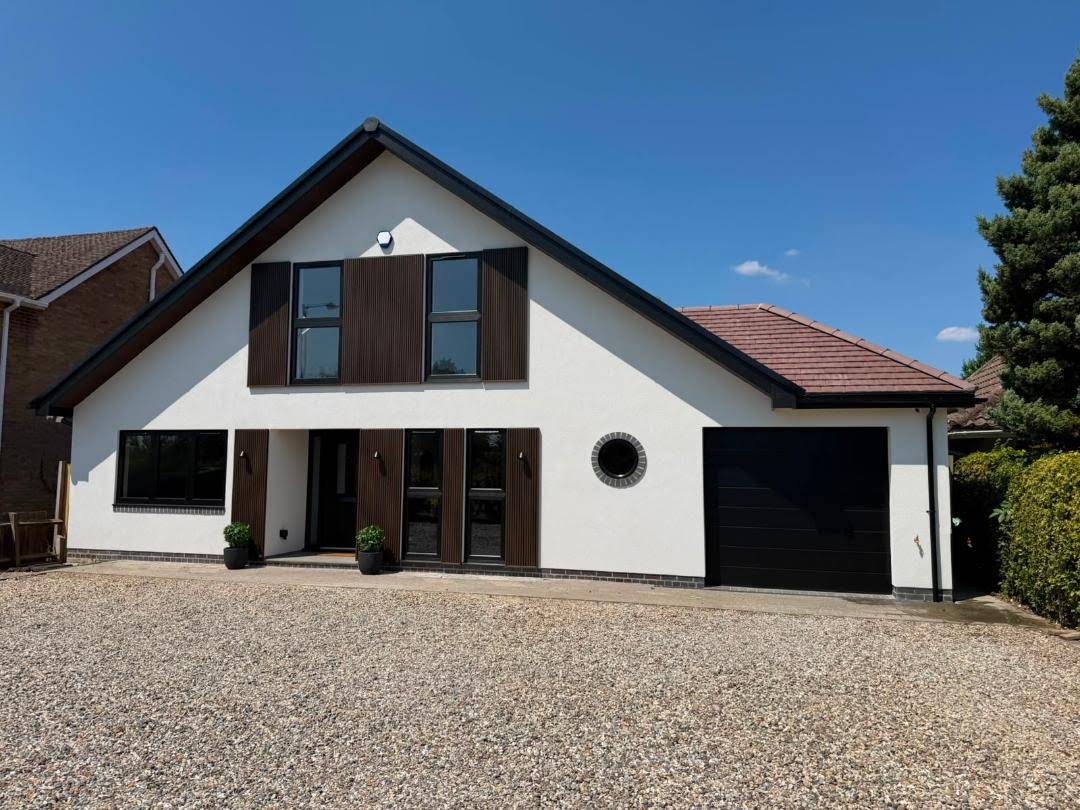 Finished Belmax exterior with white render and dark window detailing